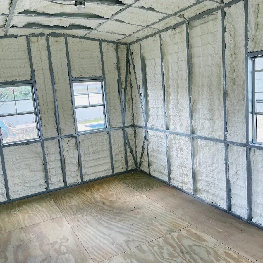 Closed-cell spray foam insulation applied to wall cavities in a residential project in Green Lake